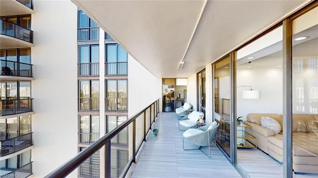 a very nice looking room with wooden floor and windows