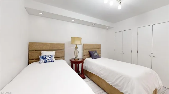 a bedroom with double bed and a lamp