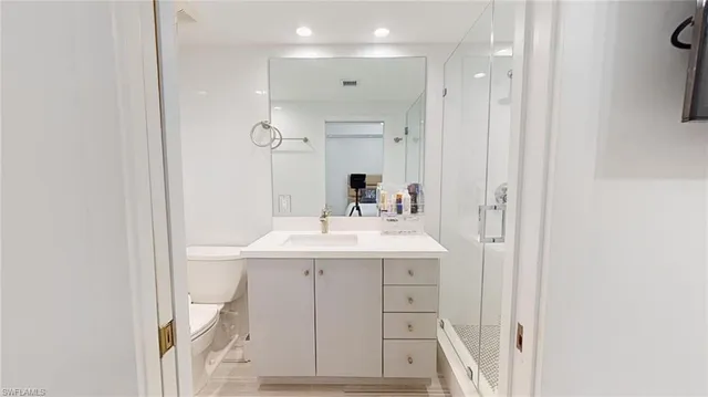 a bathroom with a sink a mirror and a vanity