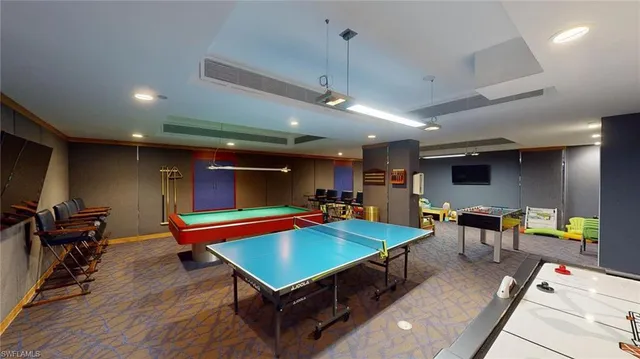 a room with furniture and pool table