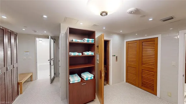 a view of hallway with wooden floor