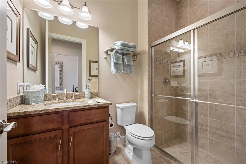 20762 Corkscrew Shores Boulevard Estero, FL 33928 - Photo 20 of 32 a bathroom with a sink a toilet and shower