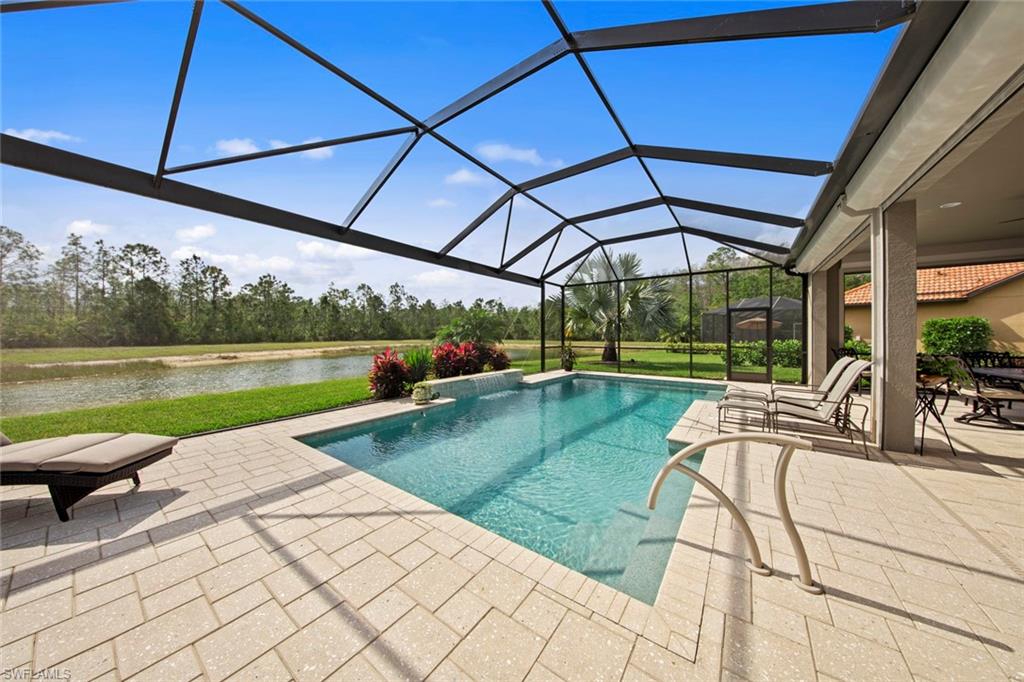20762 Corkscrew Shores Boulevard Estero, FL 33928 - Photo 25 of 32 a view of a swimming pool with a patio