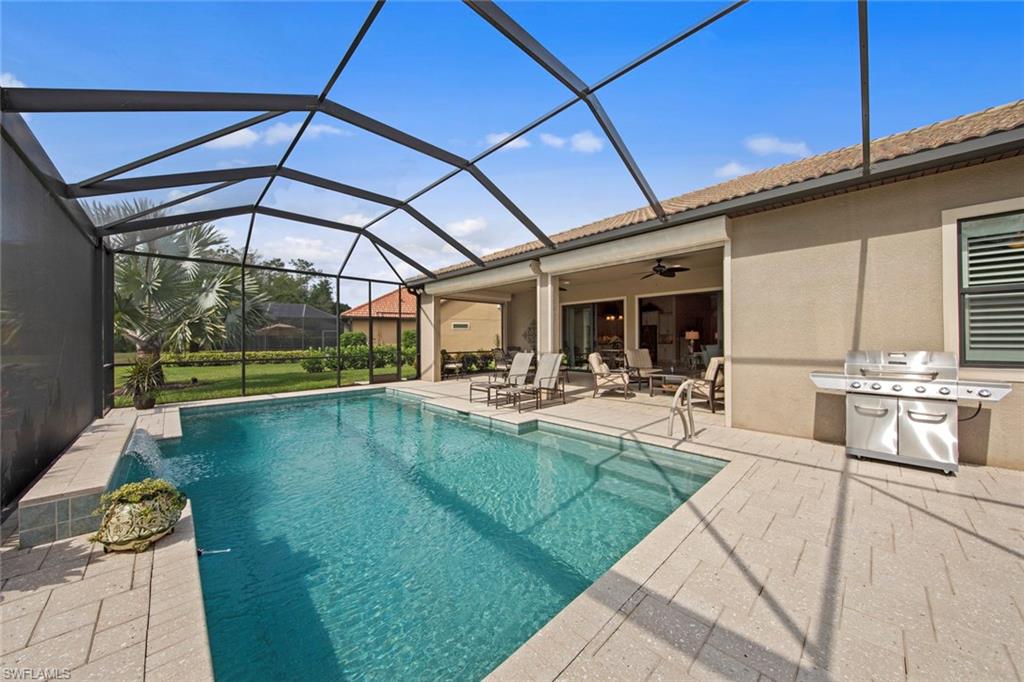 20762 Corkscrew Shores Boulevard Estero, FL 33928 - Photo 26 of 32 a view of a swimming pool with a patio