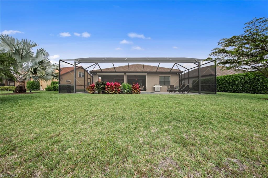 20762 Corkscrew Shores Boulevard Estero, FL 33928 - Photo 30 of 32 a view of a house with a big yard