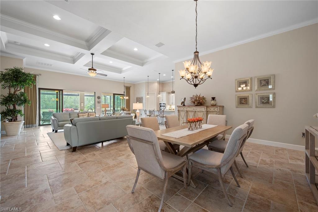 20762 Corkscrew Shores Boulevard Estero, FL 33928 - Photo 10 of 32 a dining room with furniture a chandelier and window