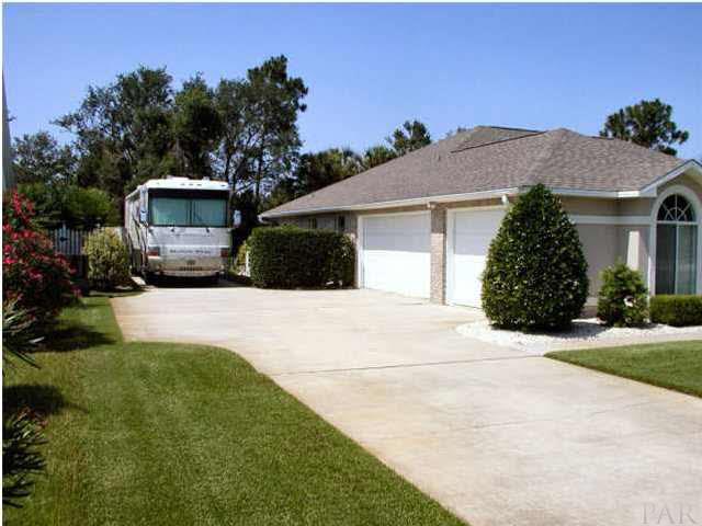 2565 Crescent Road Navarre, FL 32566 - Photo 2 of 15 THREE CAR SIDE ENTRY GARAGE