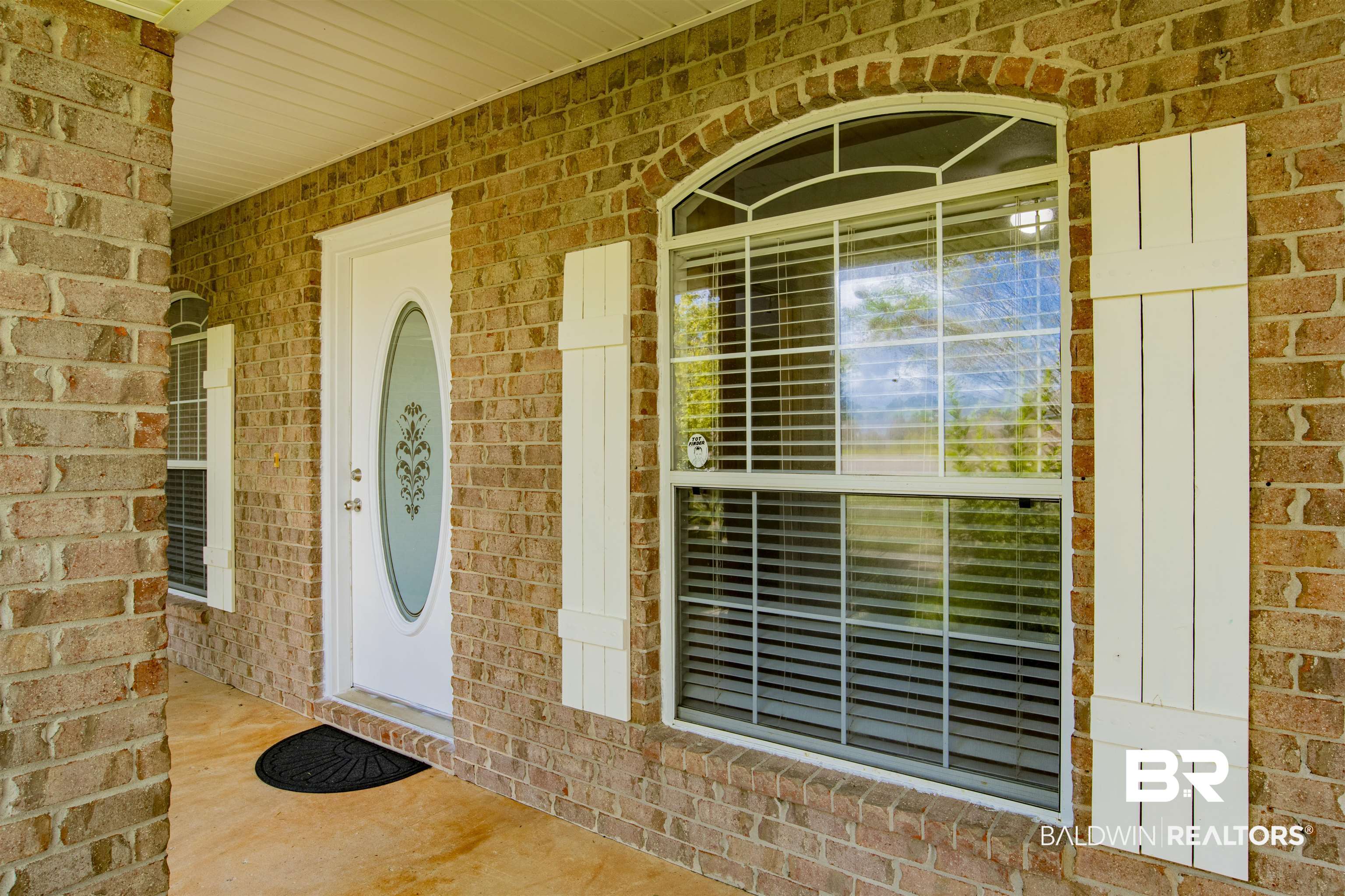 165 Pemberton Loop Fairhope, AL 36532 - Photo 3 of 25 Doorway to property with brick siding and a porch