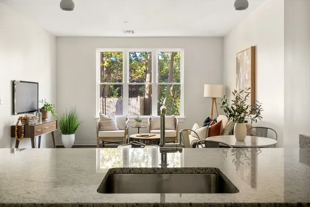 a view of living room with furniture and window