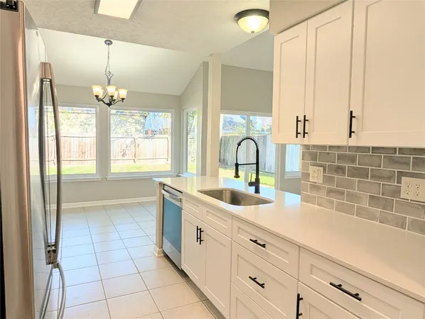 a kitchen with a sink and cabinets