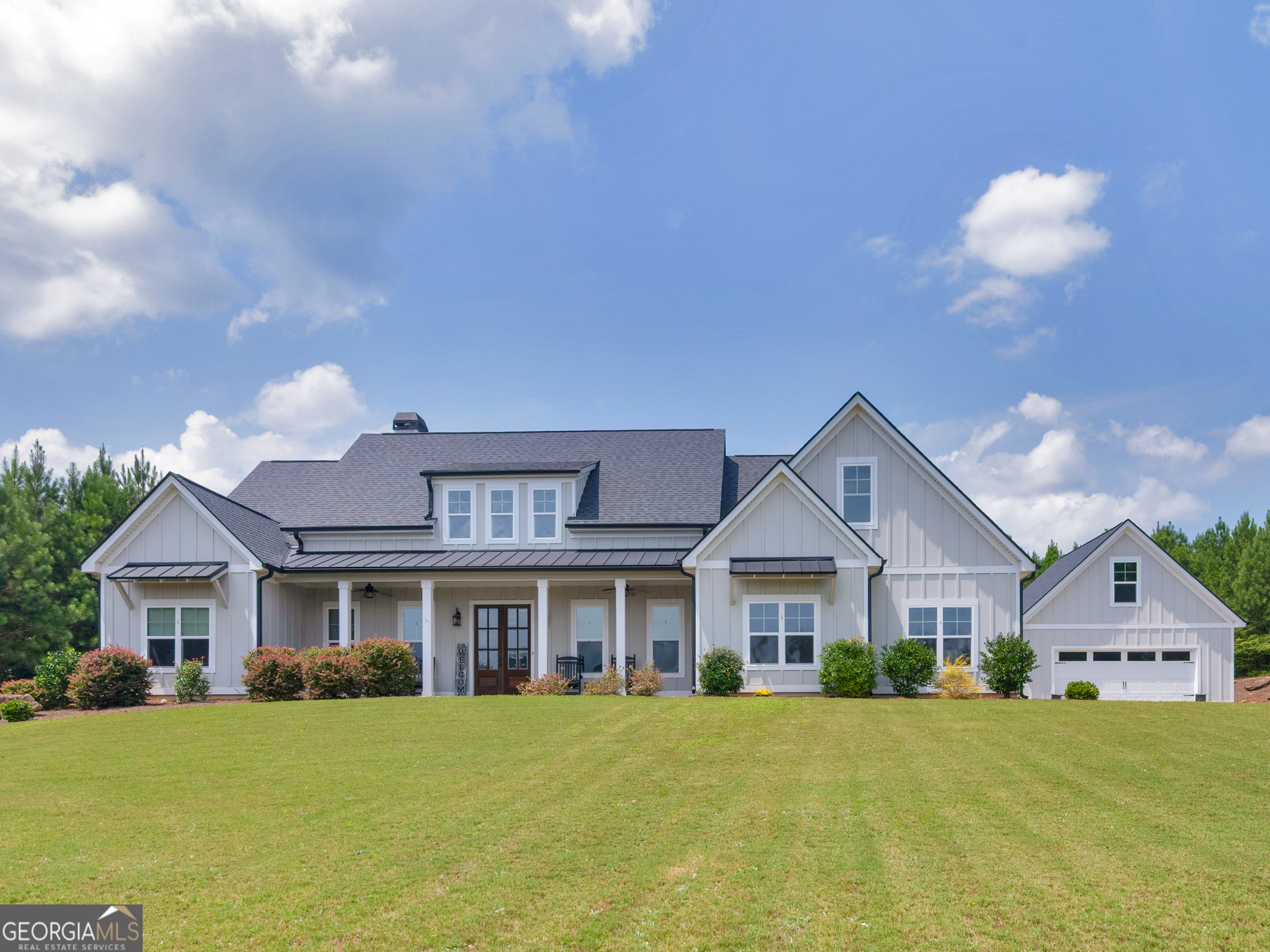a front view of a house with a yard