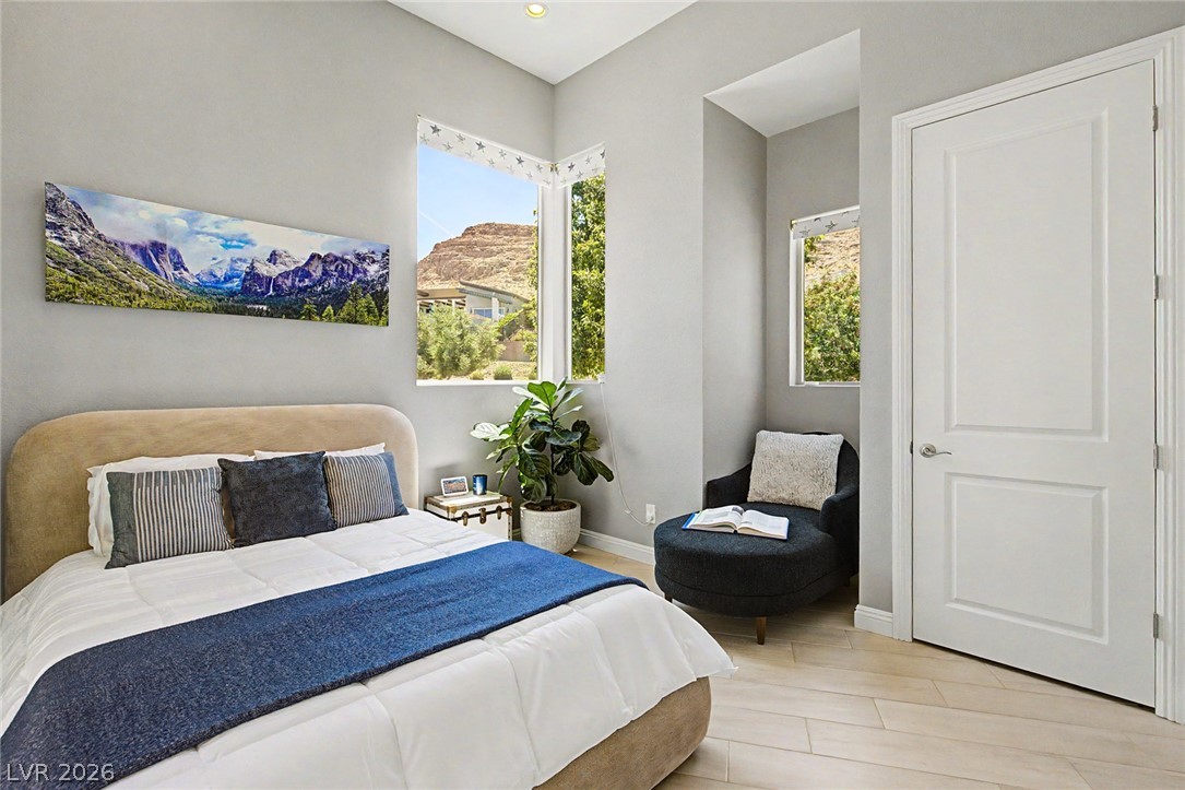 6014 Willow Ridge Court Las Vegas, NV 89135 - Photo 52 of 99 This inviting bedroom offers natural light and a cozy corner retreat.