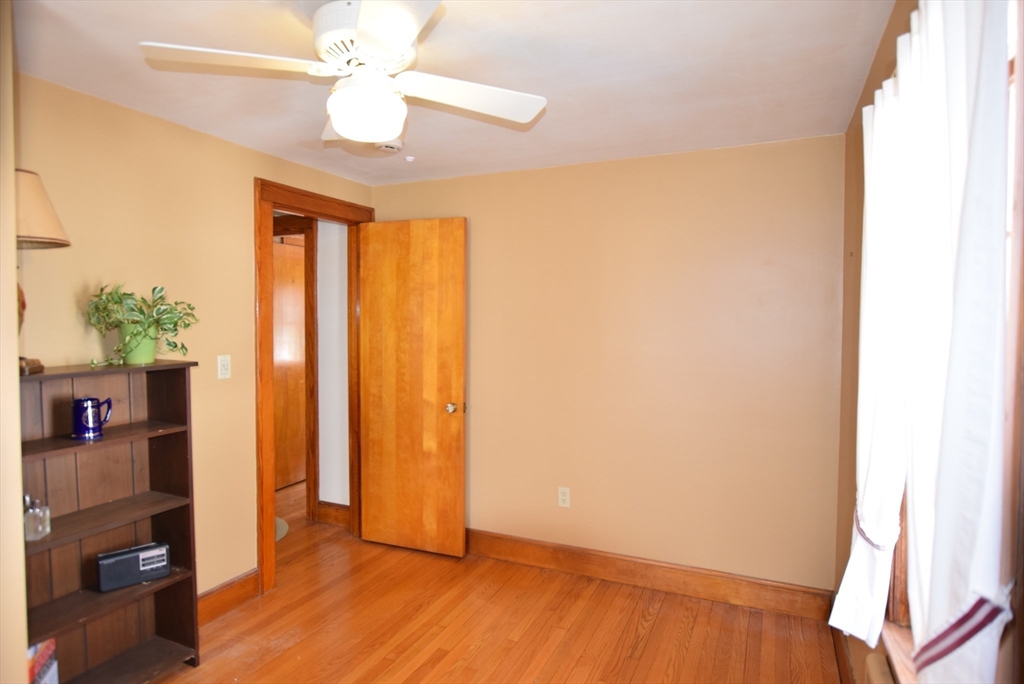 42 Herbert Street Wakefield, MA 01880 - Photo 12 of 16 wooden floor in an empty room with a window