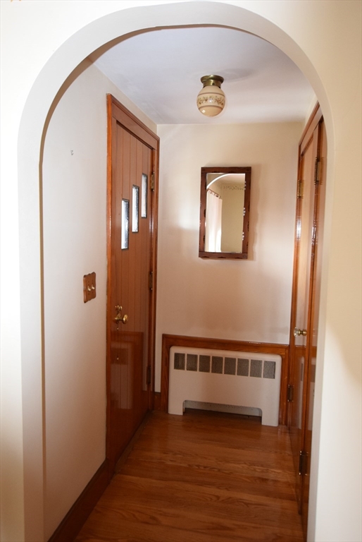 42 Herbert Street Wakefield, MA 01880 - Photo 2 of 16 a view of a hallway with wooden floor and entryway