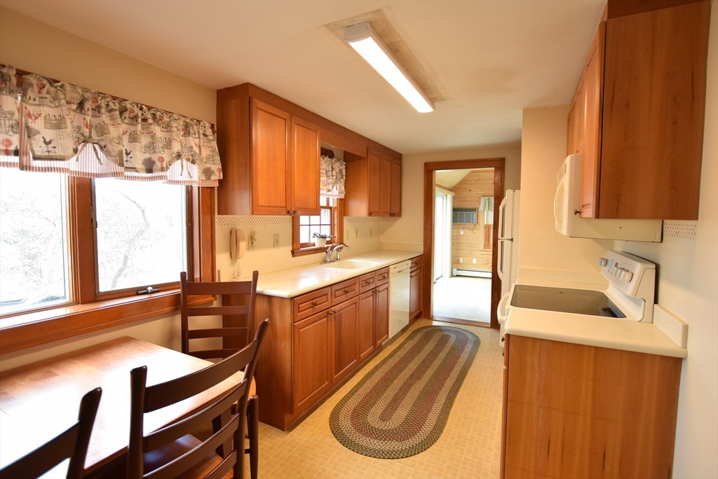 42 Herbert Street Wakefield, MA 01880 - Photo 4 of 16 a kitchen with wooden cabinets and sink