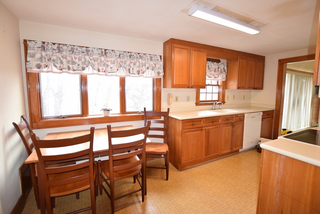 42 Herbert Street Wakefield, MA 01880 - Photo 5 of 16 a view of a kitchen with a sink and a large window