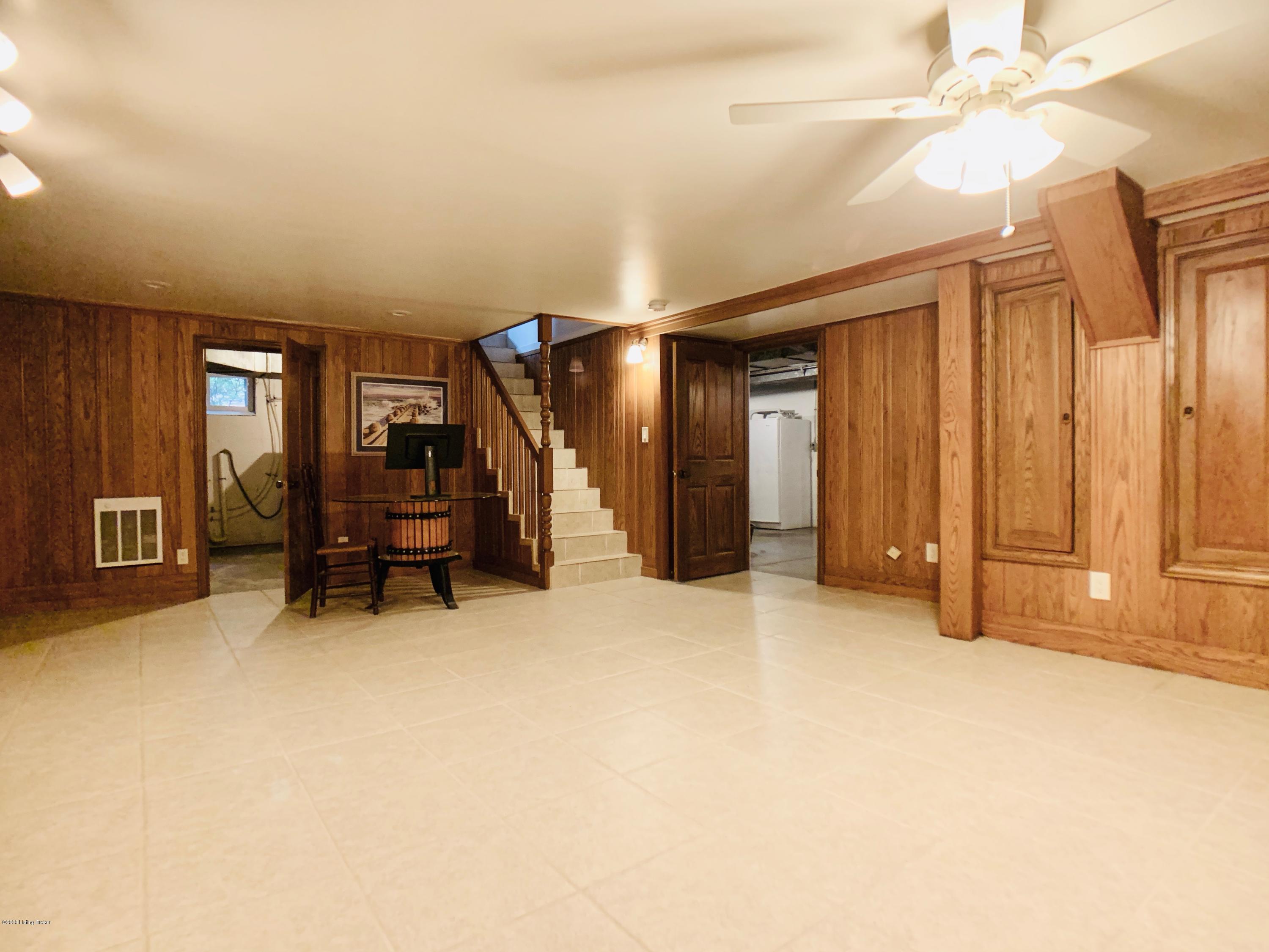 3214 Chickadee Road Louisville, KY 40213 - Photo 34 of 61 Finished basement Recreation Room. Note the walls are not panelling. They are actual Tongue and Groove Hardwood Planks.