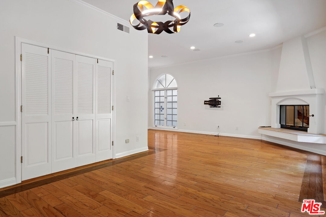 131 Reef Mall Marina del Rey, CA 90292 - Photo 11 of 43 a view of an empty room with a window and wooden floor