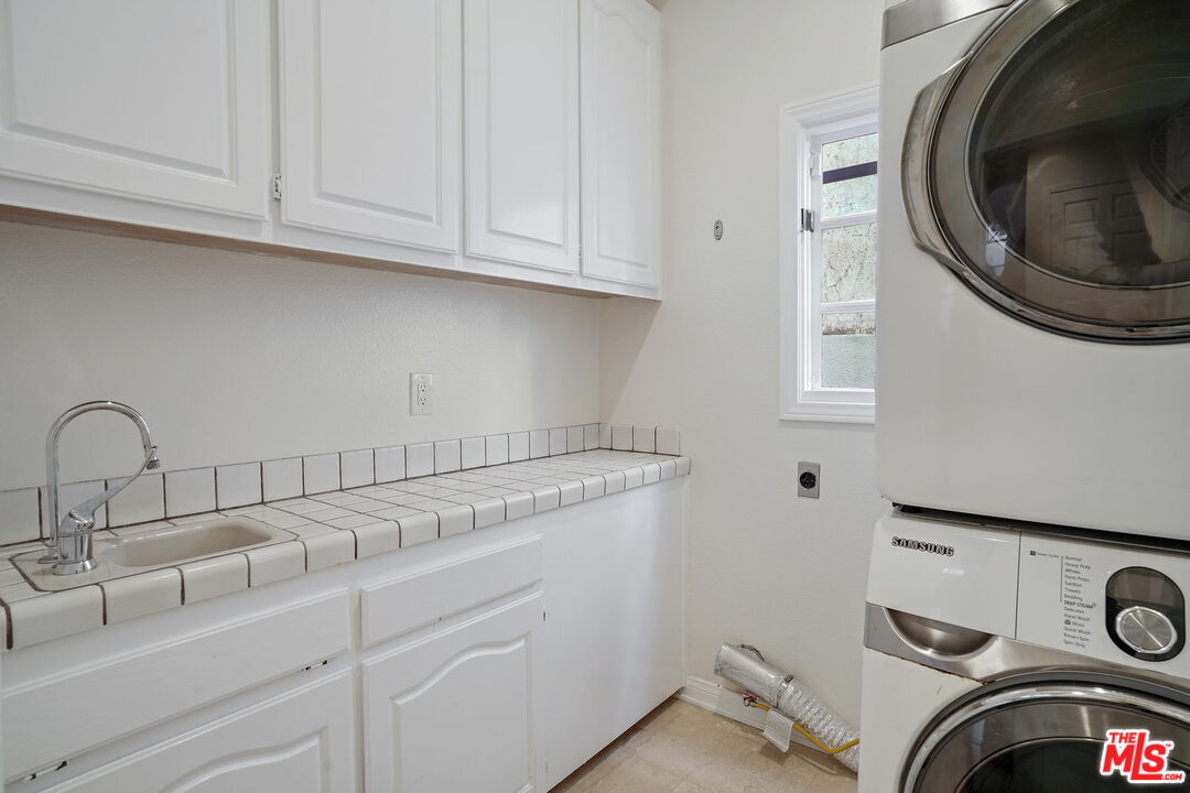 131 Reef Mall Marina del Rey, CA 90292 - Photo 15 of 43 a utility room with sink dryer and washer
