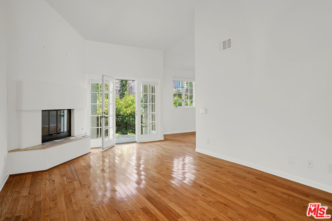 131 Reef Mall Marina del Rey, CA 90292 - Photo 20 of 43 a view of an empty room with wooden floor and a window