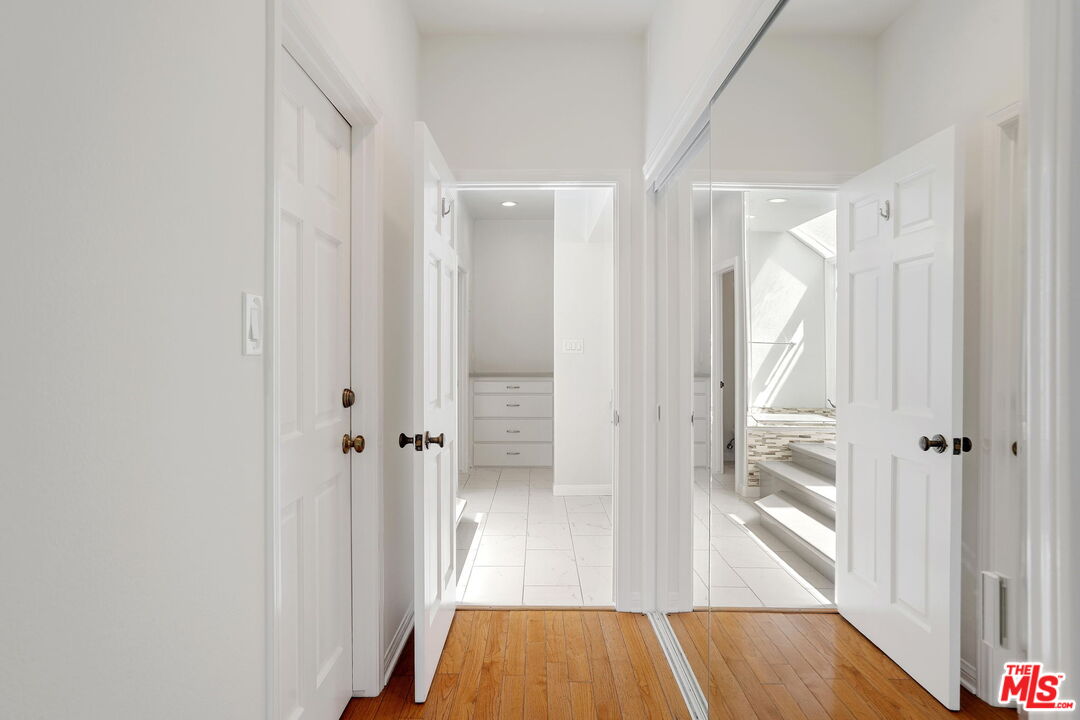 131 Reef Mall Marina del Rey, CA 90292 - Photo 23 of 43 a view of a hallway with wooden floor and closet area