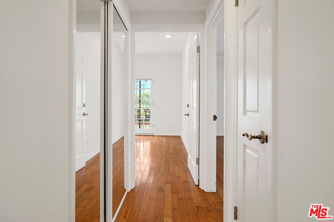 131 Reef Mall Marina del Rey, CA 90292 - Photo 29 of 43 a view of a hallway with wooden floor and closet area