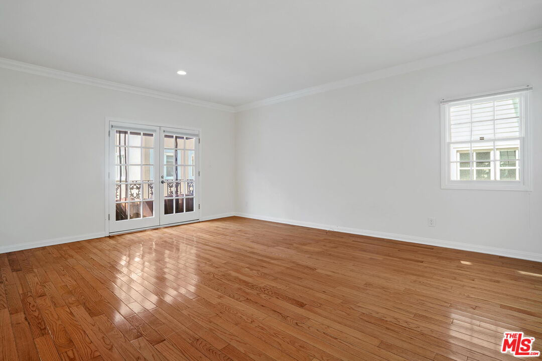 131 Reef Mall Marina del Rey, CA 90292 - Photo 31 of 43 a view of an empty room with wooden floor and a window