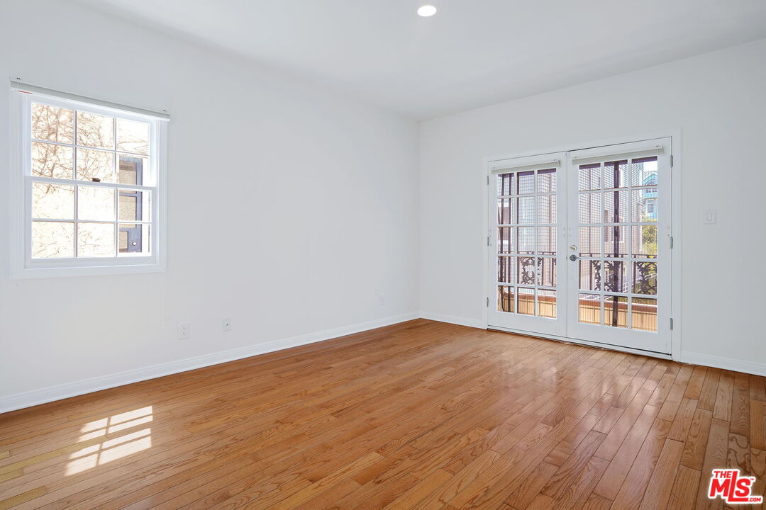 131 Reef Mall Marina del Rey, CA 90292 - Photo 33 of 43 a view of an empty room with wooden floor and a window