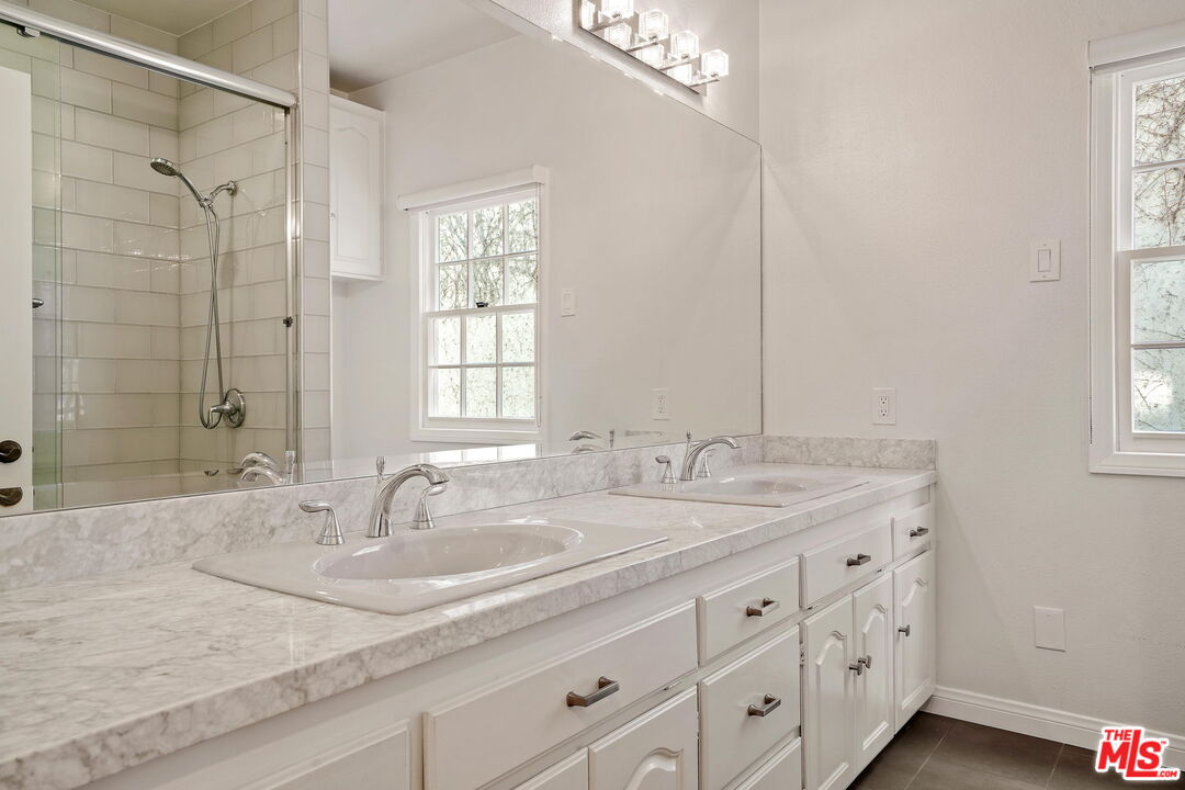 131 Reef Mall Marina del Rey, CA 90292 - Photo 35 of 43 a bathroom with double sink and a mirror
