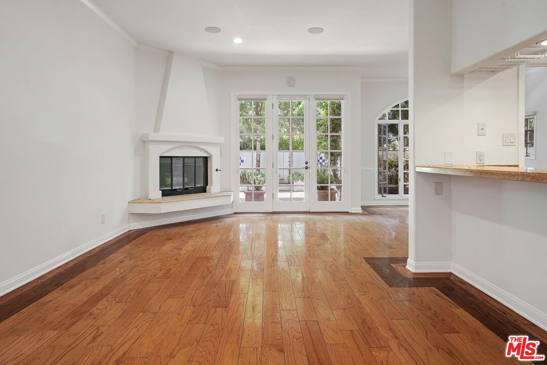 131 Reef Mall Marina del Rey, CA 90292 - Photo 7 of 43 a view of an empty room with wooden floor and a window