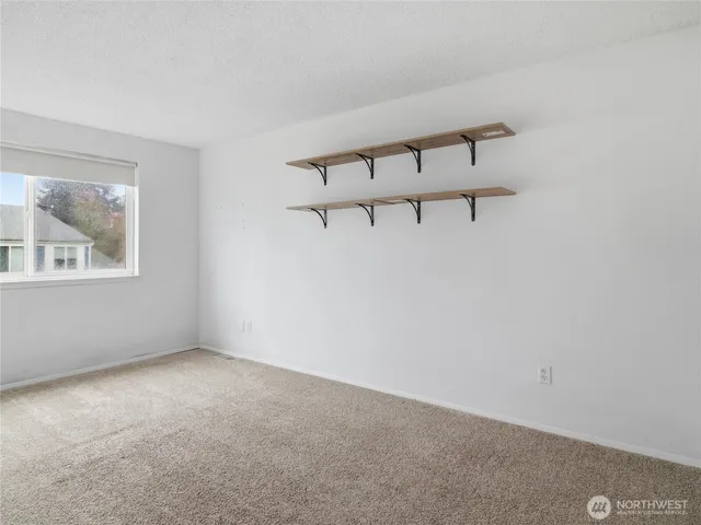 a view of a room with rack on the wall