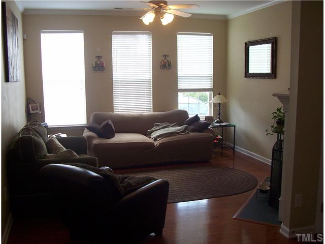 7880 Spungold Street Raleigh, NC 27617 - Photo 5 of 11 a living room with furniture and a window