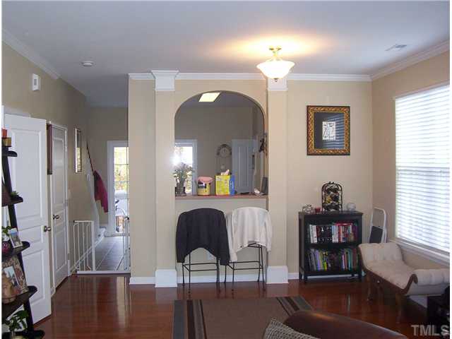 7880 Spungold Street Raleigh, NC 27617 - Photo 6 of 11 a view of a livingroom with furniture window and wooden floor