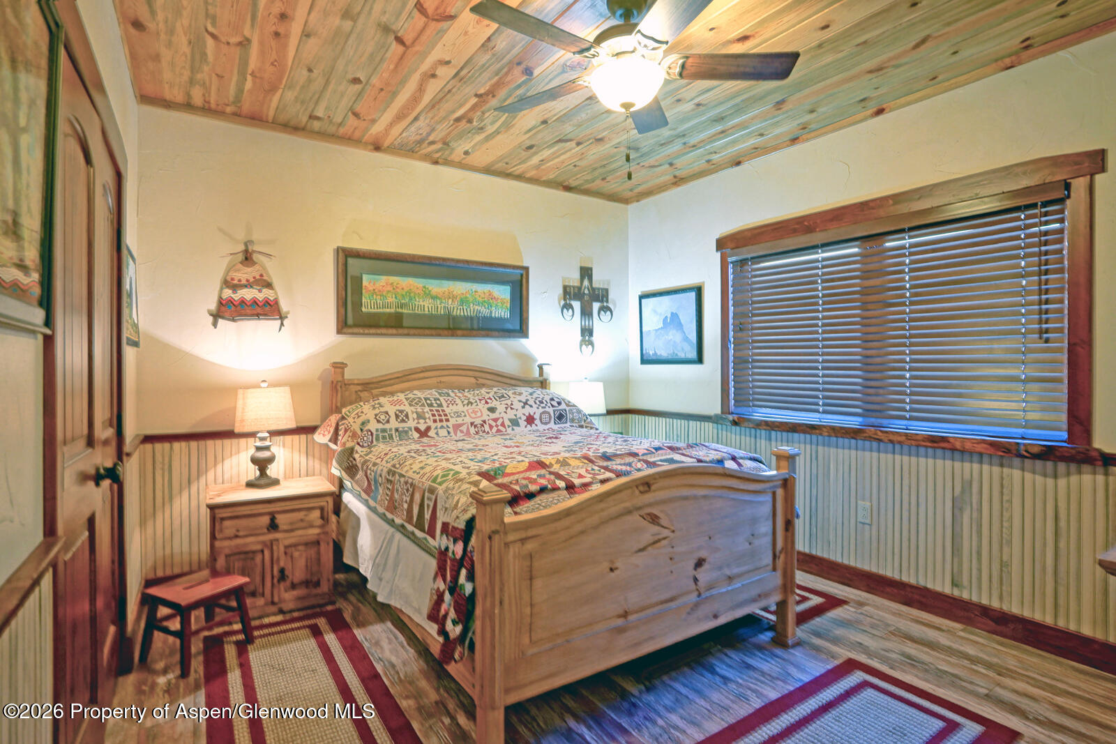 1833 Yellowstone Creek Road Gardner, CO 81040 - Photo 29 of 50 a bedroom with a bed and a chandelier