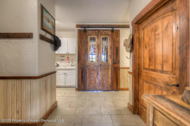 a kitchen with a stove and a refrigerator