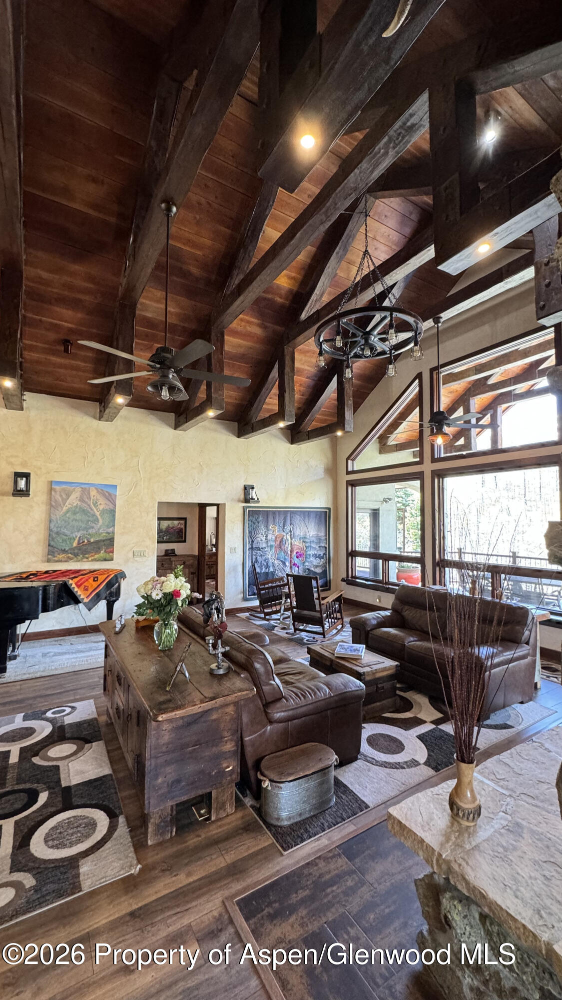 1833 Yellowstone Creek Road Gardner, CO 81040 - Photo 9 of 50 a living room with lots of furniture and a chandelier