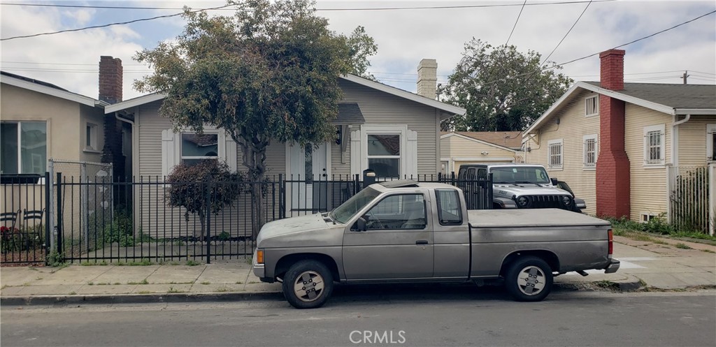 a view of a car parked in front of a house