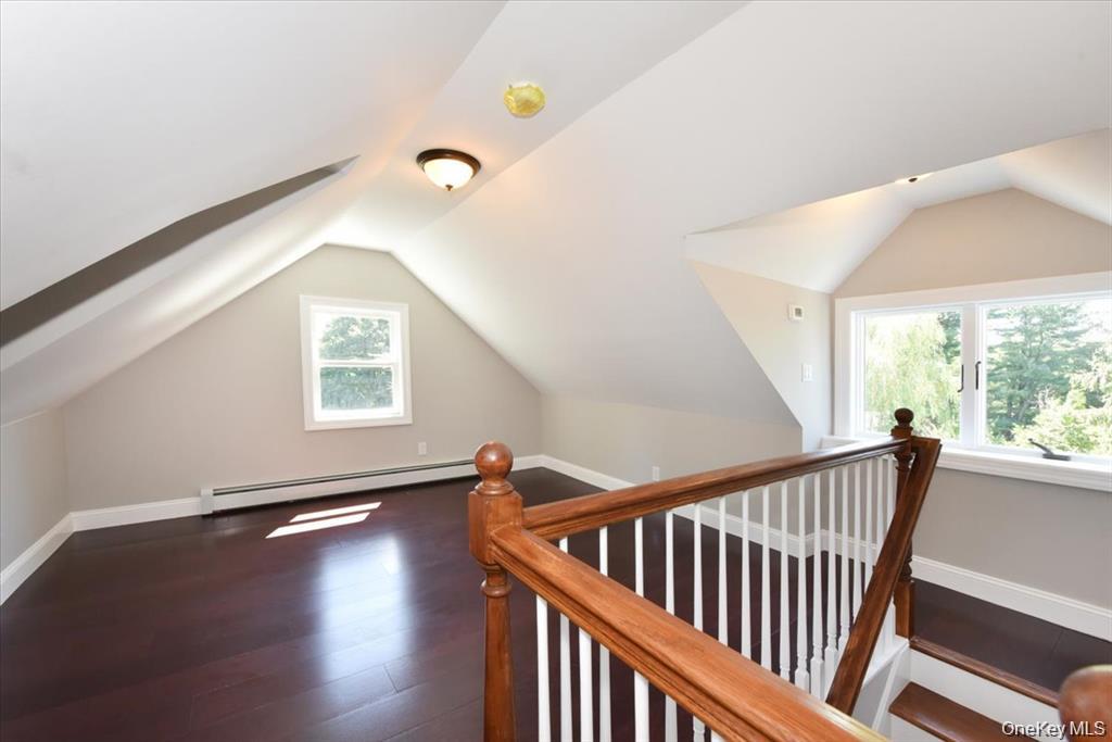 87 Dunlop Road Huntington, NY 11743 - Photo 24 of 31 a view of a hallway with windows