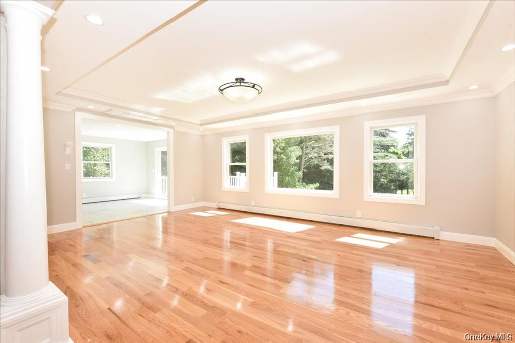 87 Dunlop Road Huntington, NY 11743 - Photo 6 of 31 a view of an empty room with a window