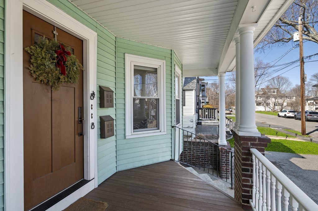 6 8 1/2 Devon Avenue, Unit 2 Beverly, MA 01915 - Photo 15 of 20 a view of a house with porch and wooden floor