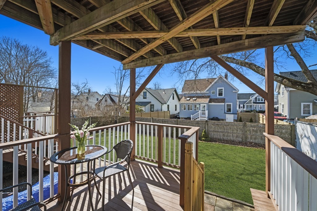 6 8 1/2 Devon Avenue, Unit 2 Beverly, MA 01915 - Photo 17 of 20 a view of a chair and table in balcony