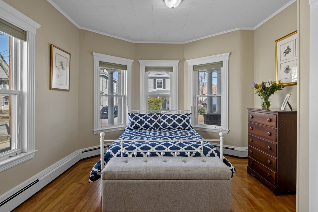 6 8 1/2 Devon Avenue, Unit 2 Beverly, MA 01915 - Photo 5 of 20 a bedroom with a bed and a dresser