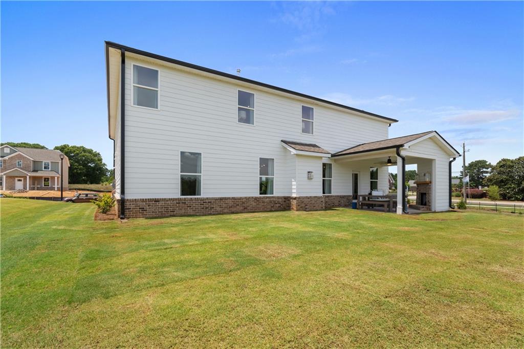 101 Buffalo Trace Stockbridge, GA 30281 - Photo 57 of 60 a front view of house with yard and seating area