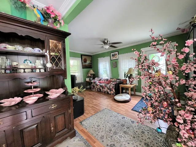 a kitchen view of a kitchen island wooden cabinets and stainless steel appliances