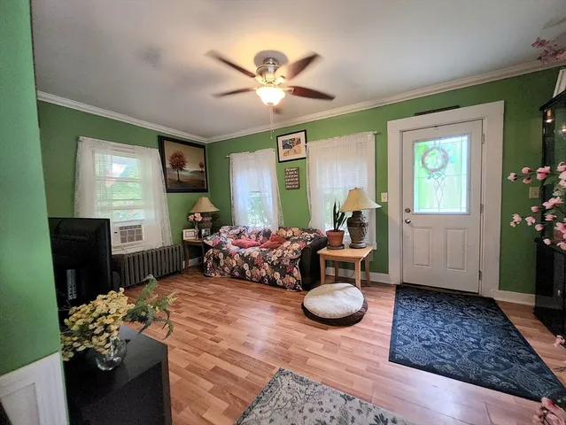 a living room with furniture and a flat screen tv