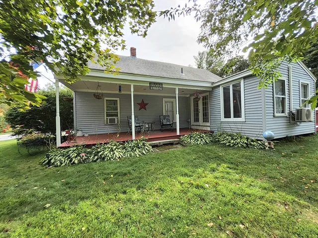 front view of a house with a garden