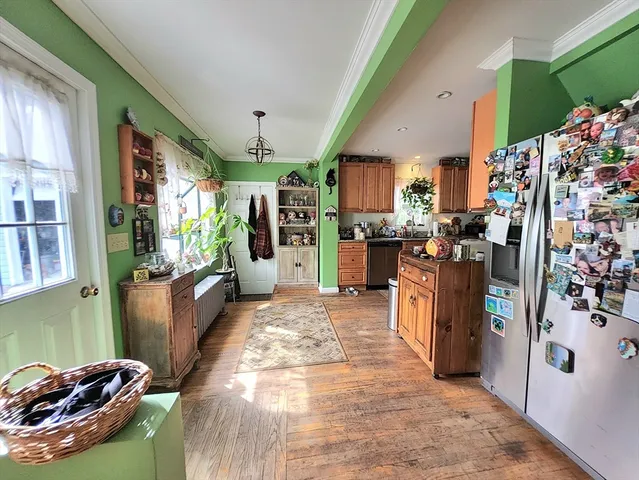 a view of a kitchen filled with furniture and a kitchen