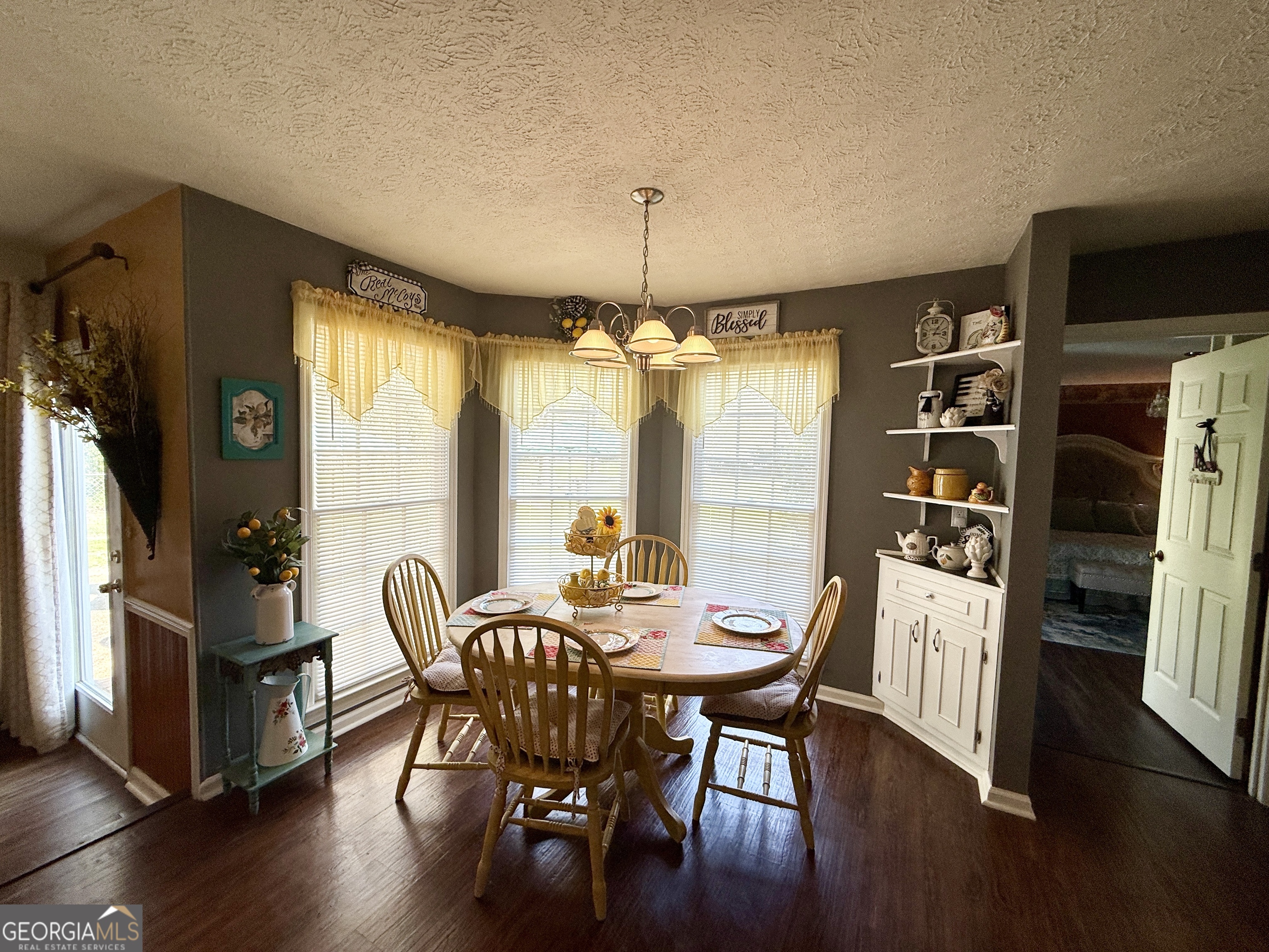 104 Monte Place Cordele, GA 31015 - Photo 17 of 52 a dining room with furniture window and wooden floor