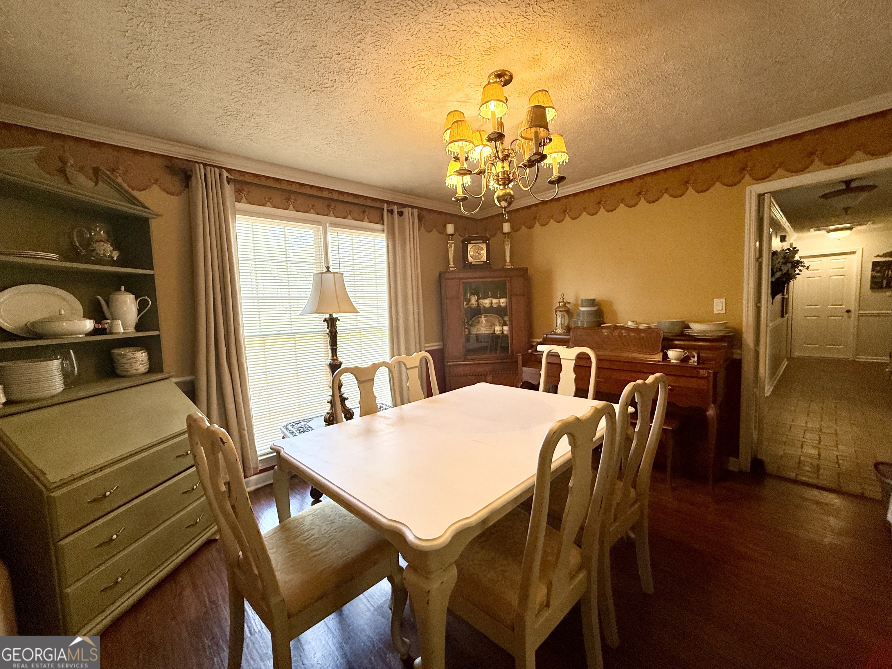 104 Monte Place Cordele, GA 31015 - Photo 18 of 52 a view of a dining room with furniture window and wooden floor