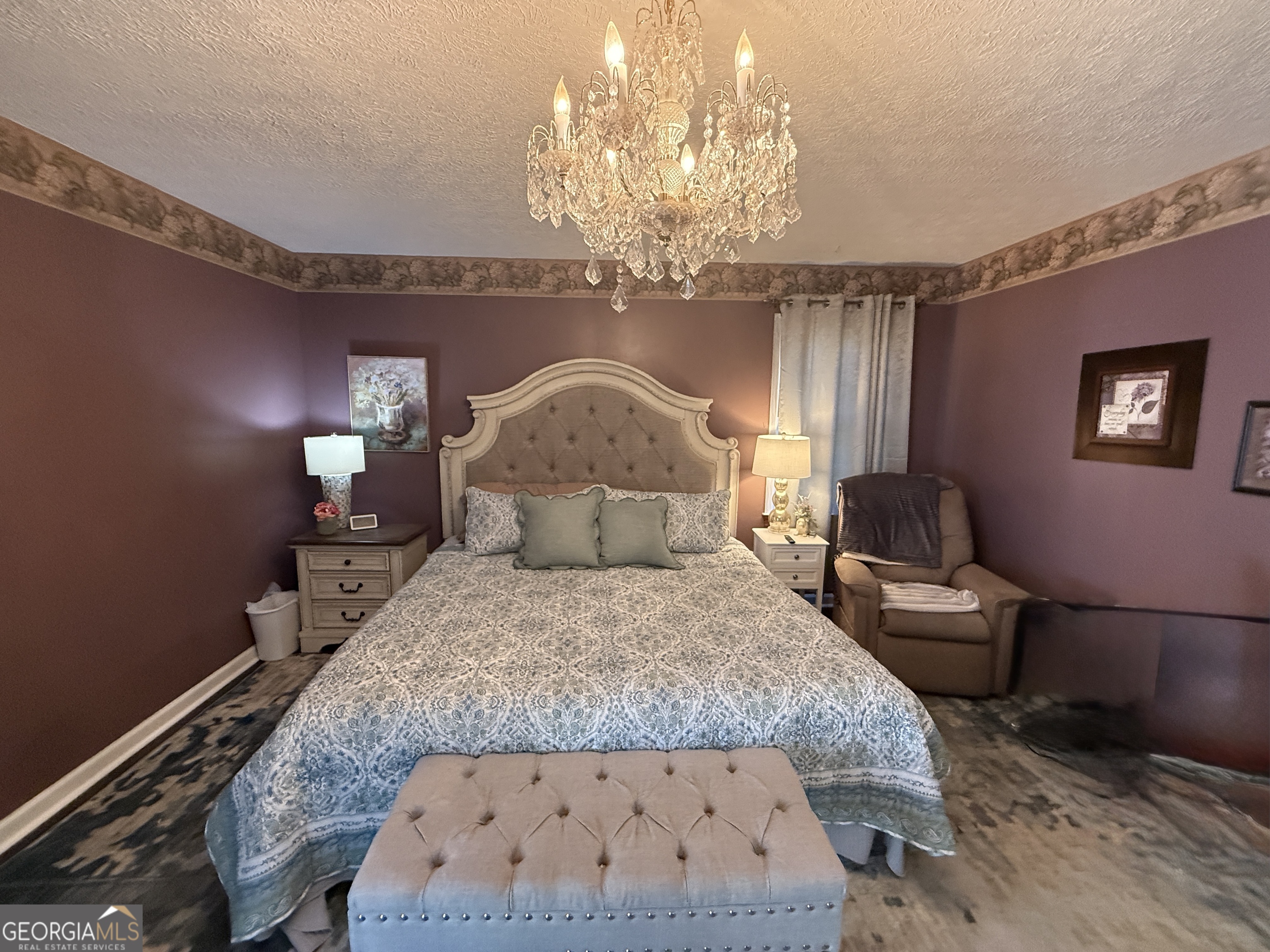 104 Monte Place Cordele, GA 31015 - Photo 19 of 52 a bedroom with a bed and a chandelier